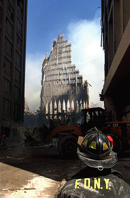 NYC firefighter looks up at remnent of the  World Trade Tower
