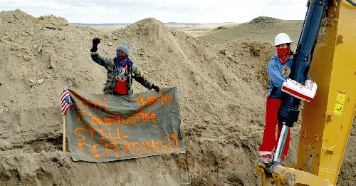 Water protectors attached themselves to construction equipment and brought the pipeline's construction to a stop on Tuesday., From ImagesAttr