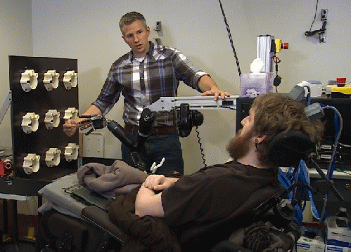 Researcher Rob Gaunt prepares Nathan Copeland for brain computer interface sensory test., From ImagesAttr