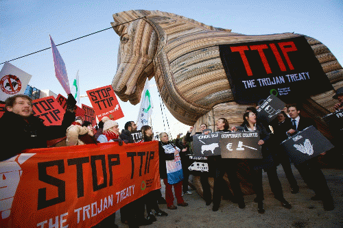 Trojan Horse at TTIP demonstration in Europe. TTIP may hijack Jill Stein's green New Deal by making job stimulus impossible for US cities by including government procurement provisions that would make US infrastructure projects part of a common labor mark, From ImagesAttr