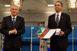President Barack Obama uncomfortably accepting the Nobel Peace Prize from Committee Chairman Thorbjorn Jagland in Oslo, Norway, Dec. 10, 2009.