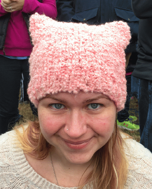 Anna Bruffy of Sea Side Fiber Arts wearing one of the pussy caps she makes