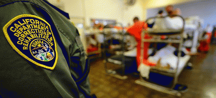 Prison guard with prisoner bunks., From ImagesAttr