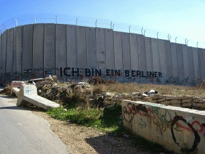 A section of the barrier -- erected by Israeli officials to prevent the passage of Palestinians -- with graffiti using President John F. Kennedy's famous quote when facing the Berlin Wall, A section of the barrier -- erected by Israeli officials to prevent the passage of Palestinians -- with graffiti using President John F. Kennedy's famous quote when facing the Berlin Wall,