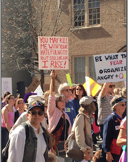 this sign says: You may kill me with your hatefulness but still like air, I rise!