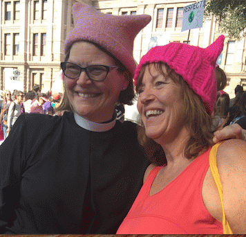 Christy's friend Karyn sports a hat just knitted by this priest, a stranger, also at the march