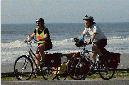 Michele Darr pulling her twin daughters with Vernon Huffman on the Oregon coast.