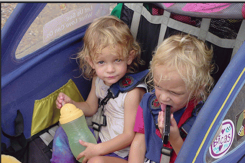 Twins Grace and Willow in the bike trailer that was their home for six months in 2007.