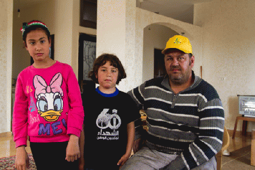 Shahar with his son Bilal (5-yo) and daughter Sahar (8-yo). Photo: ISM/Charlie Donnelly, From ImagesAttr