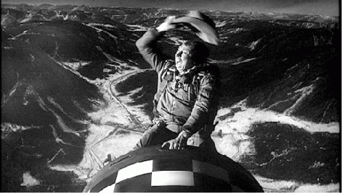 A scene from .Dr. Strangelove,. in which the bomber pilot (played by actor Slim Pickens) rides a nuclear bomb to its target in the Soviet Union., From ImagesAttr