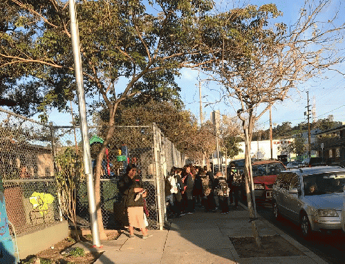 Charter school students line up to enter the Ann Street School separate from their public school counterparts., From ImagesAttr