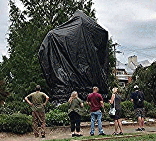 Statue of Robert E. Lee being covered in Charlottesville, VA, From ImagesAttr