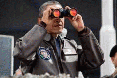 Near the ceasefire line between North and South Korea, President Barack Obama uses binoculars to view the DMZ from Camp Bonifas, March 25, 2012. Near the ceasefire line between North and South Korea, President Barack Obama uses binoculars to view the DMZ from Camp Bonifas, March 25, 2012.