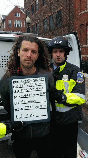 Journalist Alexei Wood being arrested by a DC police officer while covering the inauguration protests, From ImagesAttr