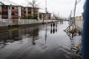 Puerto Rican residents walk in flooded streets in Condado, San Juan, Puerto Rico, Sept. 22, 2017, following Hurricane Maria., From ImagesAttr