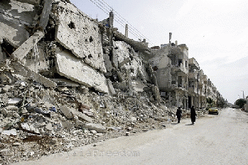 From flickr.com: Syrian women walk past destruction of their homesland, From ImagesAttr