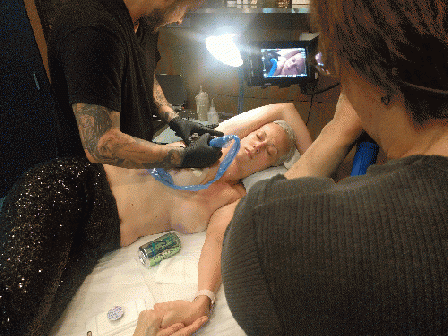 Dana Kupper (Director of Photography) filming Grace being tattooed by David at Pioneer Tattoo, Chicago; May, 2017