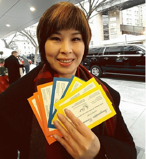 Julian Lin holding a handful of Trump Inauguration tickets, From ImagesAttr