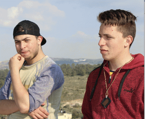 Manal's sons, Osama (22), and Mohammad (19) on a ridge at Nabi Saleh