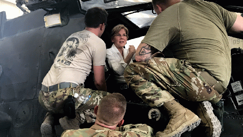 Senator Elizabeth Warren speaks to US troops while seated in a US military helicopter during a trip to the Middle East., From Uploaded