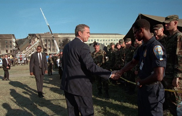 President George W Bush greets rescue workers firefighters and military personnel Sept 12 2001 while surveying damage President George W Bush greets rescue workers firefighters and military personnel Sept 12 2001 while surveying damage
