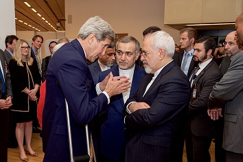 U.S. Secretary of State John Kerry speaks with Hossein Fereydoun, the brother of Iranian President Hassan Rouhani and Iranian Foreign Minister Mohammad Javad Zarif, July 14, 2015.