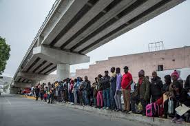 Refugees waiting at Tijuana border, From InText