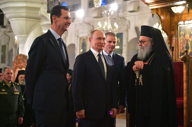 Russian leader Vladimir Putin made a surprise Christmas visit to Syria where he met with the country's president Bashar Assad The tranquility of their meeting was in sharp contrast to the hell breaking out in neighboring Iraq