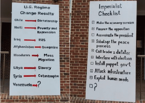 Two placards placed outside the Venezuelan embassy by the Embassy Protectors Collective. Two placards placed outside the Venezuelan embassy by the Embassy Protectors Collective.