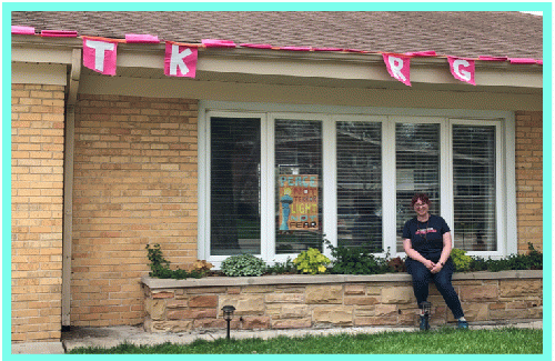 The same sign, after lots of wind,with  Jenni Grover, its creator