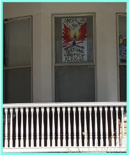 Bilingual sign on Evanston window