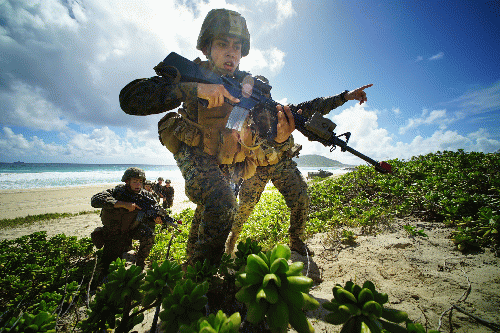 U.S. Marines storm Pyramid Rock Beach at the Marine Corps Base Hawaii in the 2016 RIMPAC exercises. Veterans for Peace is opposed to the war games., From Uploaded