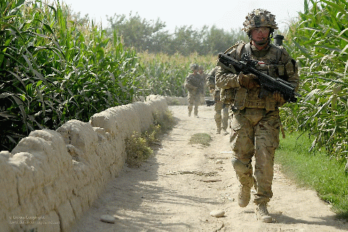 Soldier with SA80 and Underslung Grenade Launcher on Patrol in Afghanistan