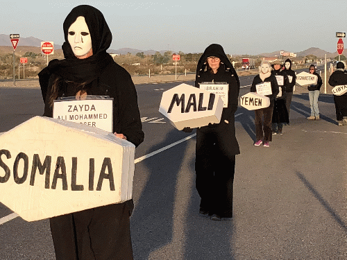 Creech women in black carrying caskets