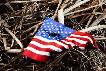 Burned american flag left in the dirt after riots at the capitol hill Burned american flag left in the dirt after riots at the capitol hill