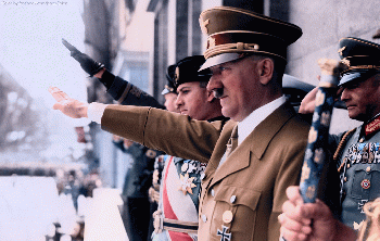 Adolf Hitler, Along with Mussolini's son-in-law, Count Galeazzo Ciano (to Hitler's right), and Joachim von Ribbentrop, attend a NSDAP (Nazi Party) rally, some time in the 1930s., From CreativeCommonsPhoto