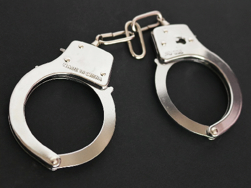 Handcuffs with black background, From CreativeCommonsPhoto