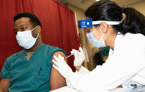 A doctor getting a lifesaving COVID vaccination, From Uploaded