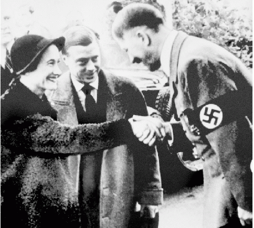 File photo dated 23/10/1937 of the Prince Edward and Duchess of Windsor meeting with German leader Adolf Hitler in Munich as Buckingham Palace has defended footage from 1933 that shows a young Queen performing a Nazi salute with her family at Balmoral, From Uploaded