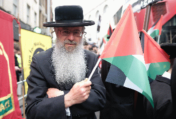 Compassion and solidarity - A Jewish man with a Palestinian flag., From CreativeCommonsPhoto