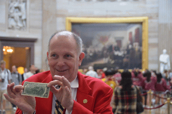 US Capitol tour guide demonstrating that John Trumbull's 'Declaration of Independence' painting appears on the back of the two-dollar bill