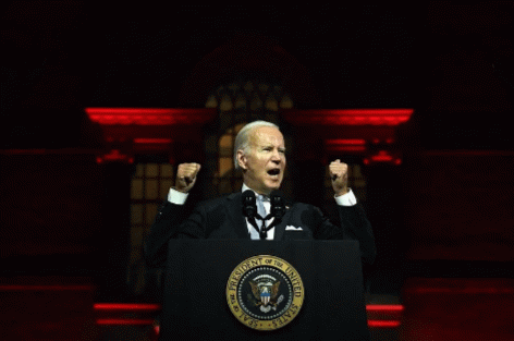Joe Biden holds up an imaginary length of chain against against the shadow of lies, From Uploaded