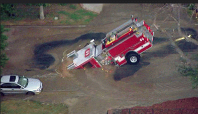 Figure 2: Another water main break scours out the dirt under a road to collapse the road, Los Angeles, 2009. Figure 2: Another water main break scours out the dirt under a road to collapse the road, Los Angeles, 2009.