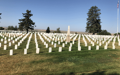 The U.S. rushes some of us into the future (Little Bighorn headstones exemplify grave dangers to our lives)., From Uploaded