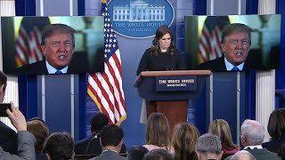 President Trump on-screen appearance at the White House press briefing to praise the recently passed tax bill. President Trump on-screen appearance at the White House press briefing to praise the recently passed tax bill.