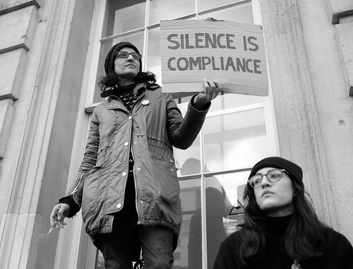 Silence is compliance - A protester with a message